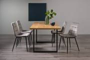 The Bentley Designs  Ramsay Rustic Oak Effect Melamine 6 Seater Dining Table with U Leg & 4 Mondrian Grey Velvet Chairs with Sand Black Powder Coated Legs