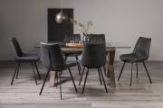  Turin Clear Tempered Glass 6 Seater Dining Table with Dark Oak Legs & 6 Fontana Dark Grey Faux Suede Fabric Chairs with Grey Hand Brushing on Black Powder Legs Black Powder Coated Legss