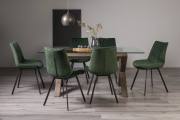 The Bentley Designs Turin Clear Tempered Glass 6 Seater Dining Table with Dark Oak Legs & 6 Fontana Green Velvet Fabric Chairs with Grey Hand Brushing on Black Powder Legs Black Powder Coated Legs