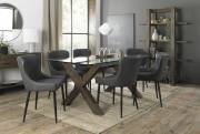 The Bentley Designs Turin Clear Tempered Glass 6 Seater Dining Table with Dark Oak Legs & 6 Cezanne Dark Grey Faux Leather Chairs with Sand Black Powder Coated Legs