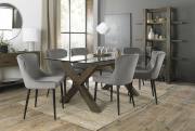 The Bentley Designs Turin Clear Tempered Glass 6 Seater Dining Table with Dark Oak Legs & 6 Cezanne Grey Velvet Chairs with Sand Black Powder Coated Legs
