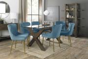 The Bentley Designs Turin Clear Tempered Glass 6 Seater Dining Table with Dark Oak Legs & 6 Cezanne Petrol Blue  Velvet Chairs with Sand Black Powder Coated Legs