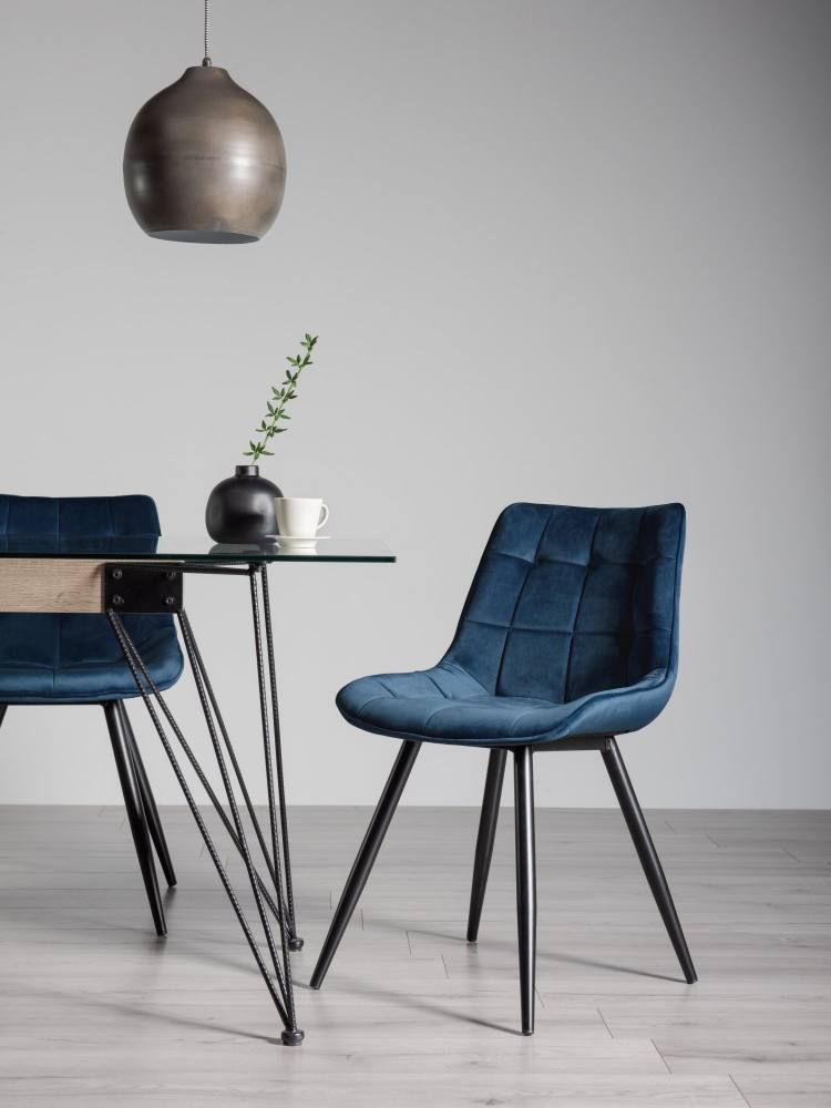 The Bentley Designs Seurat Blue Velvet Fabric Chair on Display