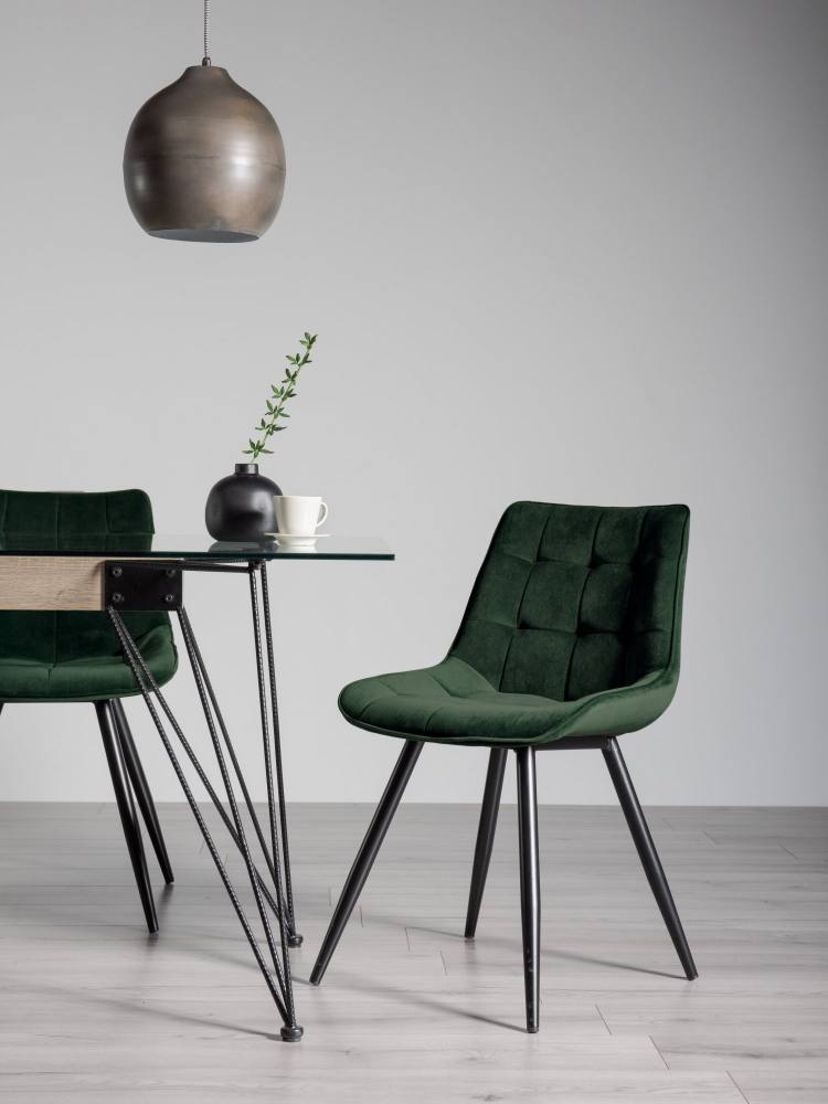 The Bentley Designs Seurat Green Velvet Fabric Chair on Display