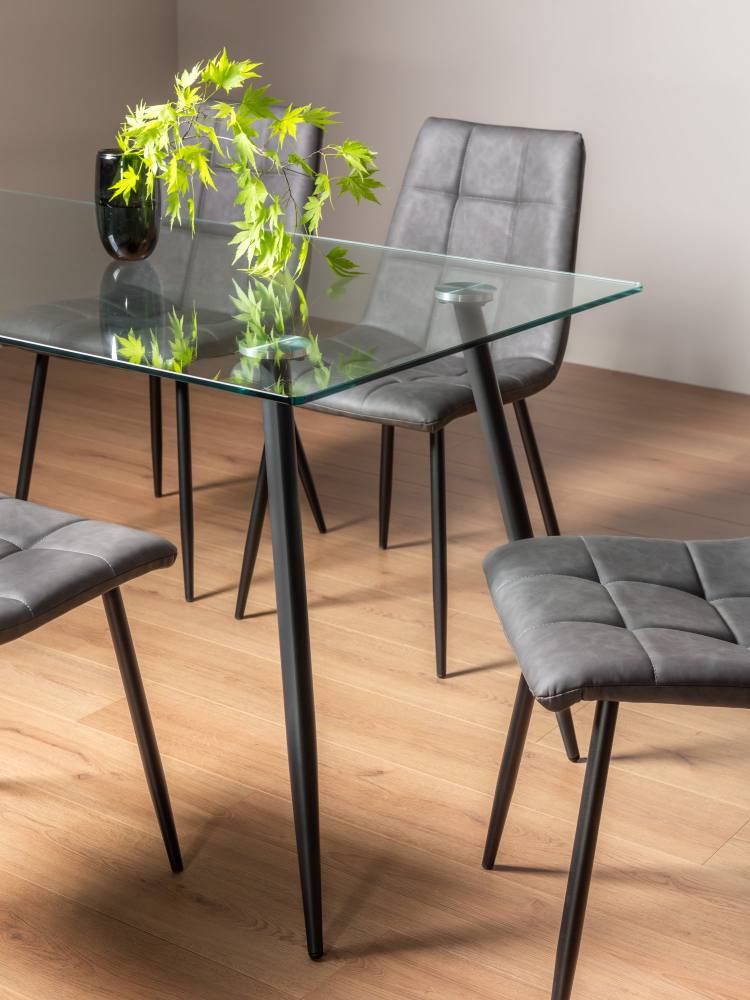 The Bentley Designs Martini Clear tempered Glass 6 Seater Dining Table on Display 