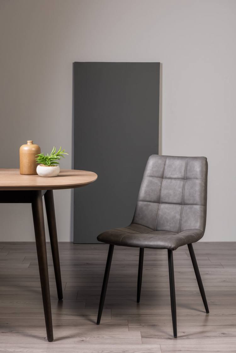 The Bentley Designs Mondrian Dark Grey Faux Leather Chair on Display
