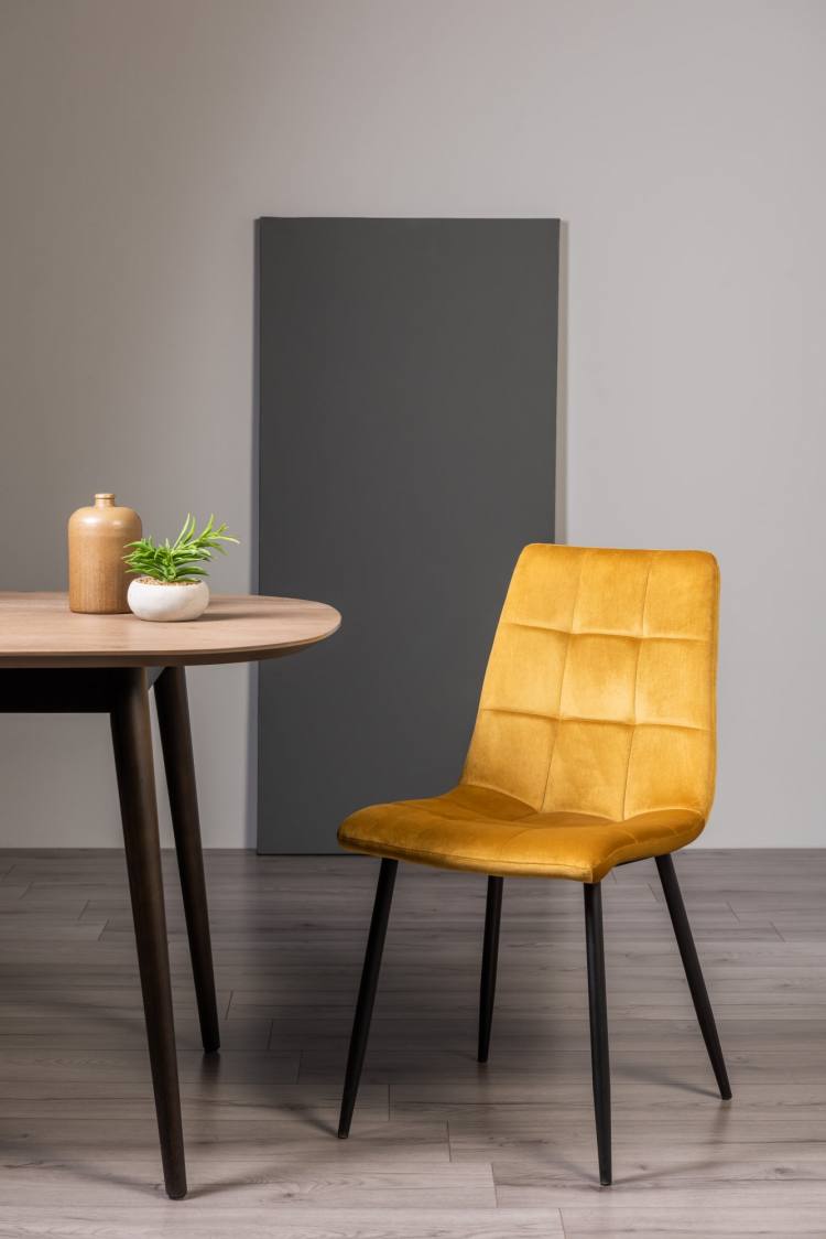 The Bentley Designs Mondrian Mustard FaVelvet Fabric Chair on Display