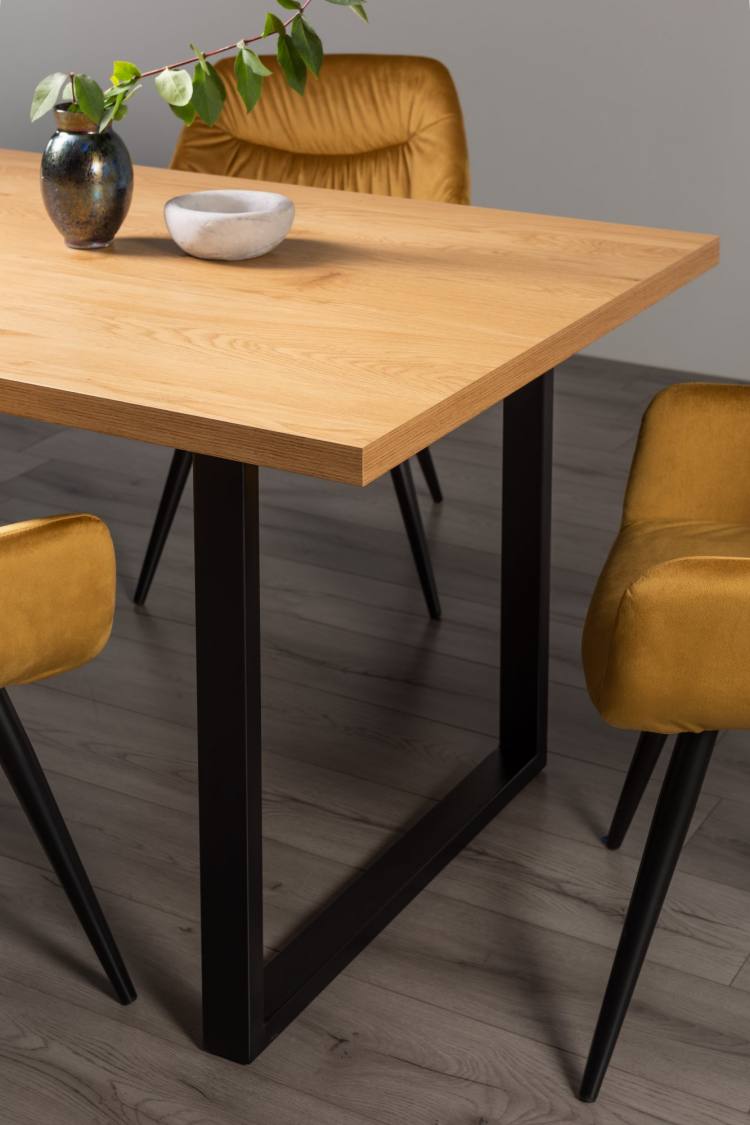 Close Up Of the Bentley Designs  Ramsay Rustic Oak Effect Melamine 6 Seater Dining Table with U Leg & 4 Dali Mustard Velvet Fabric Chairs with Sand Black Powder Coated Legs#