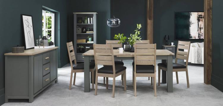 The Bentley Designs Oakham Dark Grey & Scandi Oak 4-6 Dining Table on Display with Oaakham Scandi Oak Chair in Dark Grey Faux Leather
