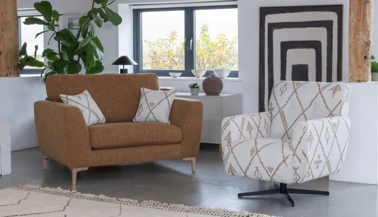 Snuggler in fabric 5903 with small scatter cushions in 5023. Swivel chair in fabric 5023