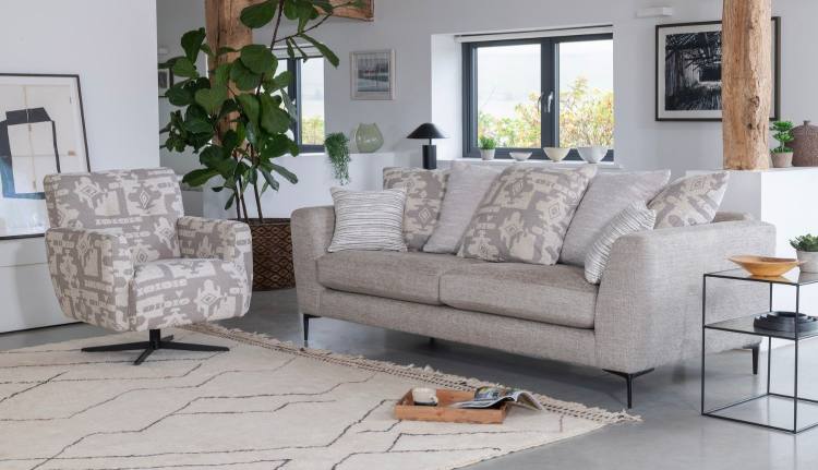 Swivel chair in fabric 5397. Grand pillow back sofa in fabric 5987 with 2 pillows in 5397, 2 pillows in 5827, 1 pillow in 5397 and small scatter cushions in 5477