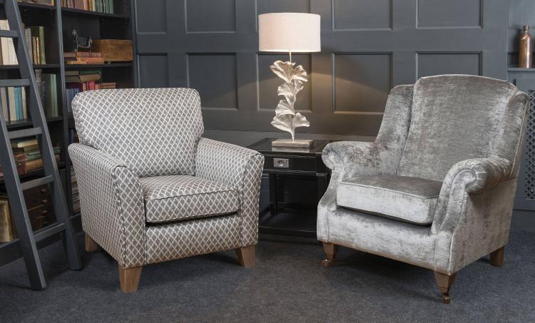 Accent chair in fabric 9767, smokey oak solid legs (AV3). Wing chair in fabric 9827, smokey oak pewter castor legs.