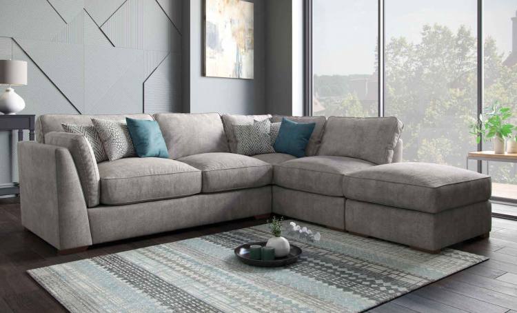 Pictured in Aaron Truffle with scatter cushions in Valencia Spot Natural, Festival Ocean and Valencia Zig Zag Natural, and Antique feet