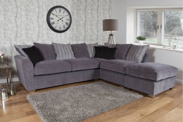 Pictured in Lassie Charcoal with Valencia Zig Zag Silver pillow back cushions, Festival Black scatter cushions and Chrome feet