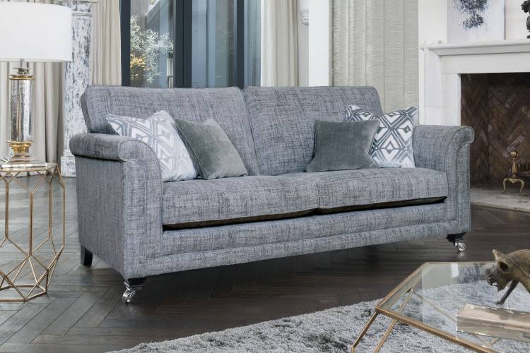 Grand sofa in fabric 2867, large scatter cushions in 2017, small scatter cushions in 2927, ebony/polished chrome castor legs (FM2).