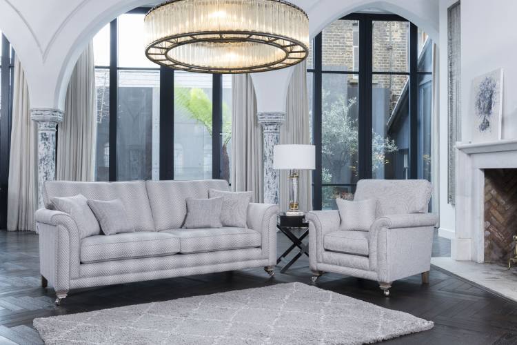 Grand sofa in fabric 8547, large scatter cushions in 8667, small scatter cushions in 8237. Chair fabric 8667, small scatter cushion in 8547. Both with smokey oak satin nickel castor legs (FM3) 