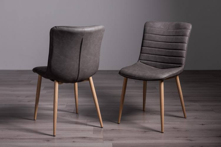 Bentley Designs Eriksen Dark Grey Faux Leather Chairs on Display