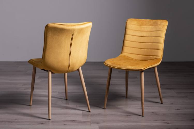 Bentley Designs Mustard Velvet Fabric Chairs on Display 