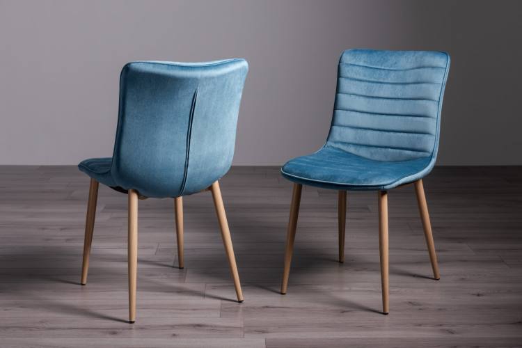 The Bentley Designs Eriksen Petrol Blue Velvet Fabric Chairs on Display