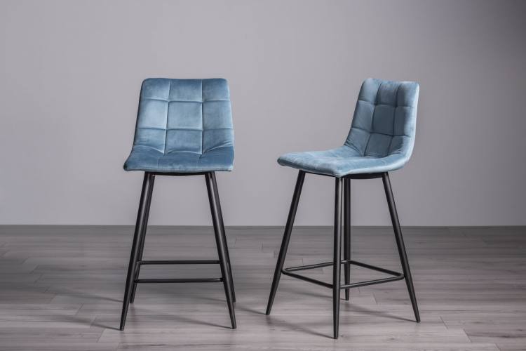 The Bentley Designs Mondrian Petrol Blue velvet fabric Bar Stools with Sand Black Powder Coated Legs on Display 