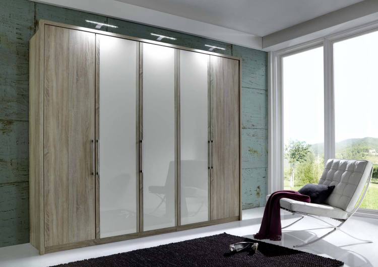 250cm wardrobe pictured in Light Rustic Oak with 3 White Glass doors. Passe-partout frame and lights sold separately.