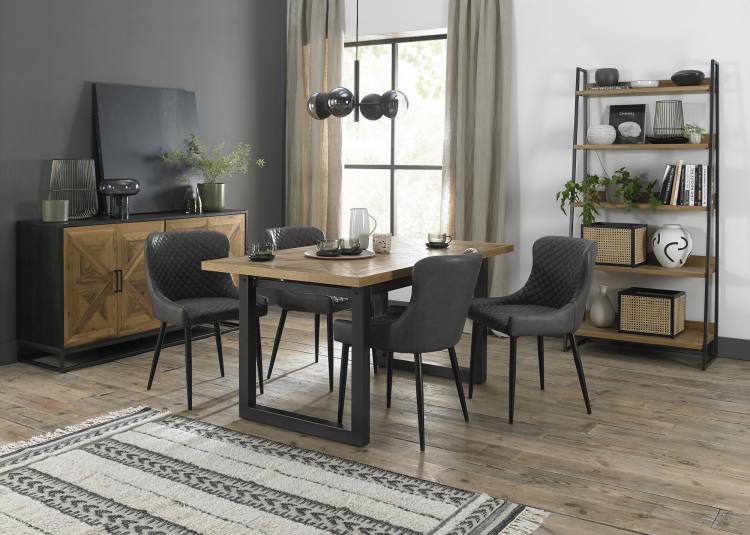 Bentley Designs Cezanne Dark Grey Faux Leather Chair on Display with Dining Table 
